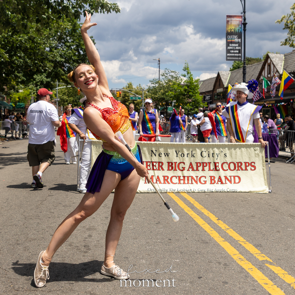 Queer Big Apple Corps baton twirler marches at Queens Pride.