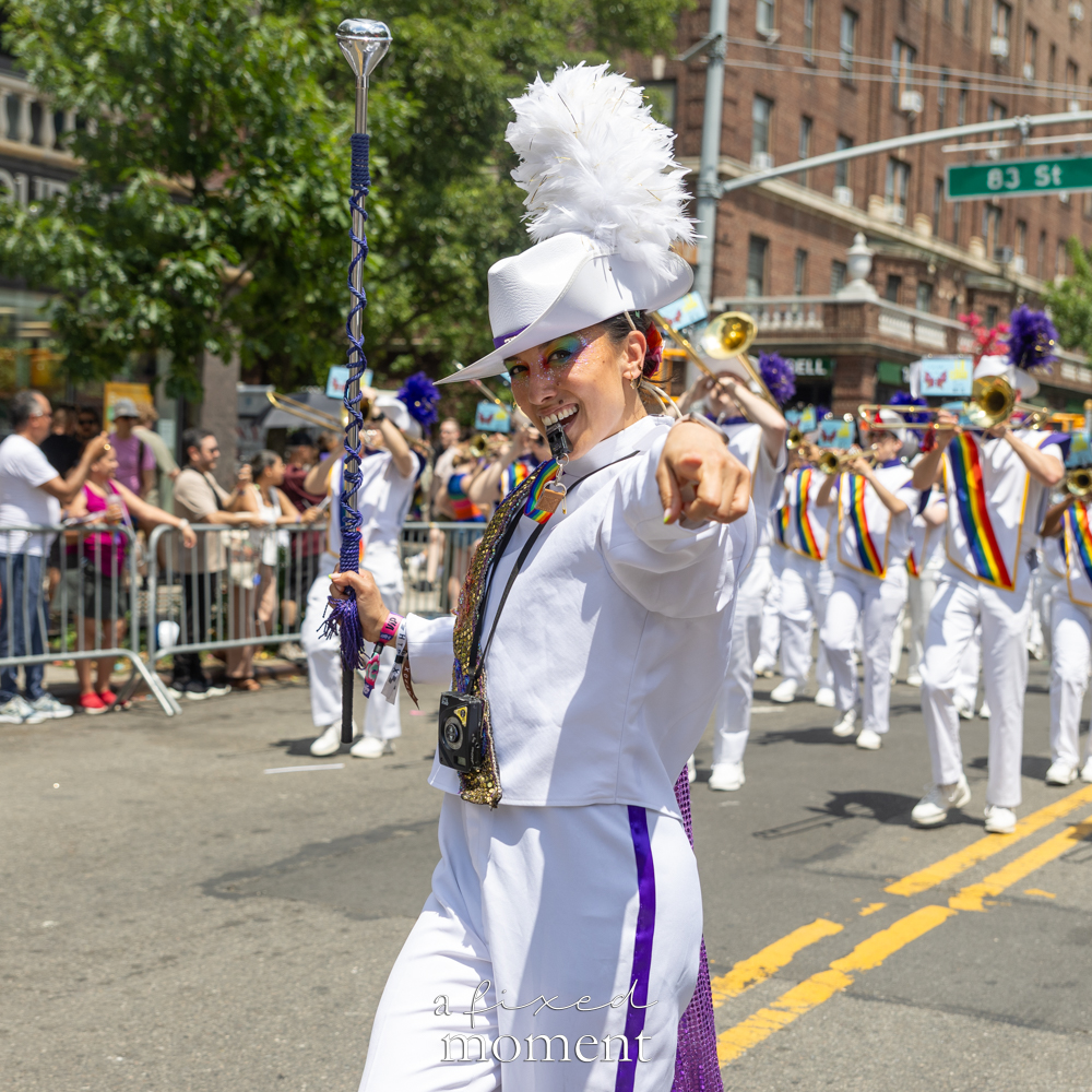 Queer Big Apple Corps drum major at the New Queens Pride Parade.