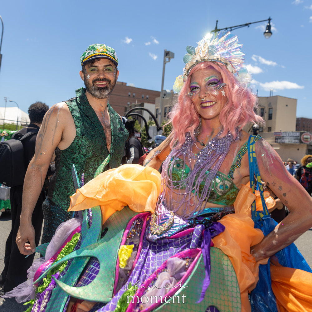 @aliluminescent in a pink mermaid costume at the Mermaid Parade.
