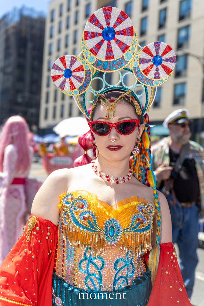 Carnival-style headdress costume portrait at the Mermaid Parade.