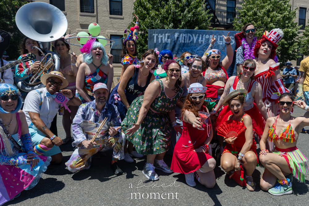 The Findyhoppers pose with instruments and a banner during the Mermaid Parade in Coney Island.