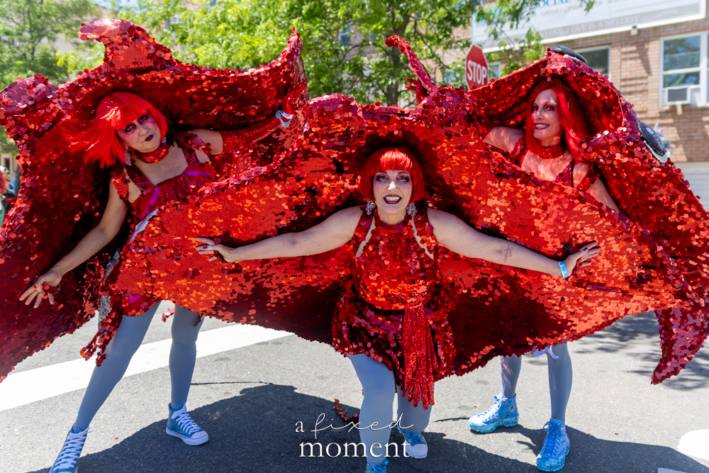 @joannearnett red sequined sea-creature group at the Mermaid Parade.