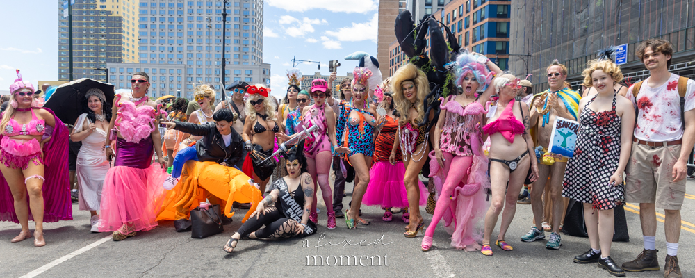 A large group of costumed participants pose during the Mermaid Parade in Coney Island.
