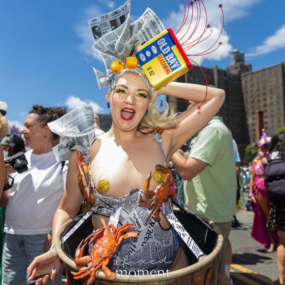 @lilmisslixx wears an Old Bay crab costume during the Mermaid Parade in Coney Island.