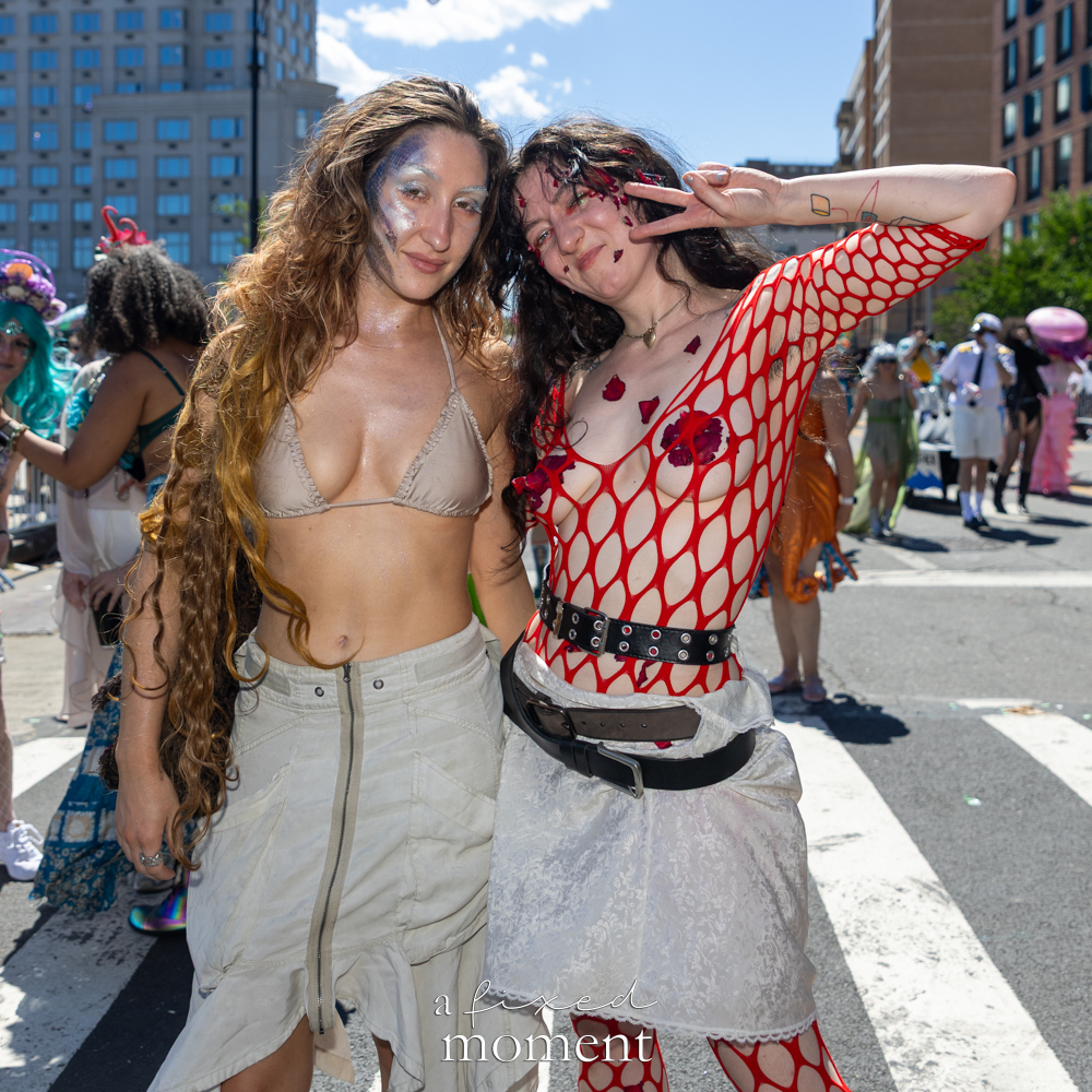 Red fishnet mermaid duo at the Mermaid Parade.