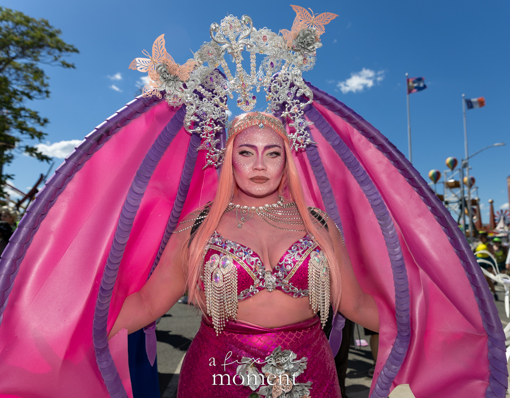 @vitanibeauty in an elaborate pink fantasy costume at the Mermaid Parade in Coney Island.