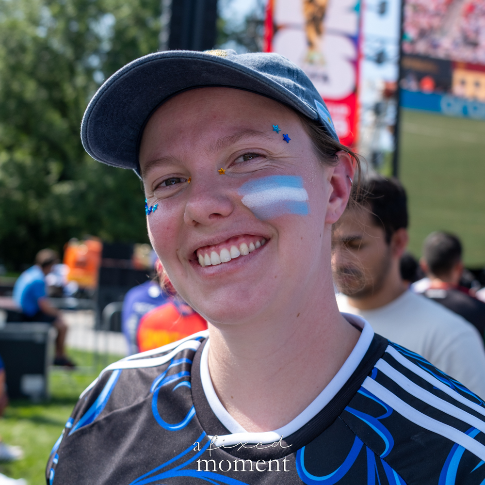Argentina supporter wearing blue and white face paint in Central Park