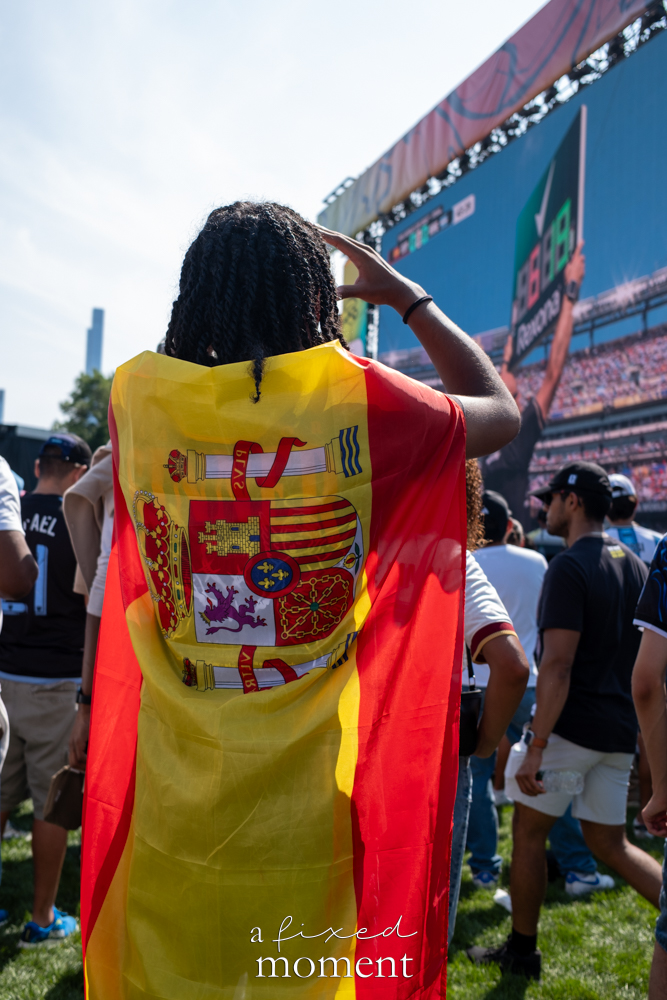 Spain supporter wearing the national flag at the Central Park watch party