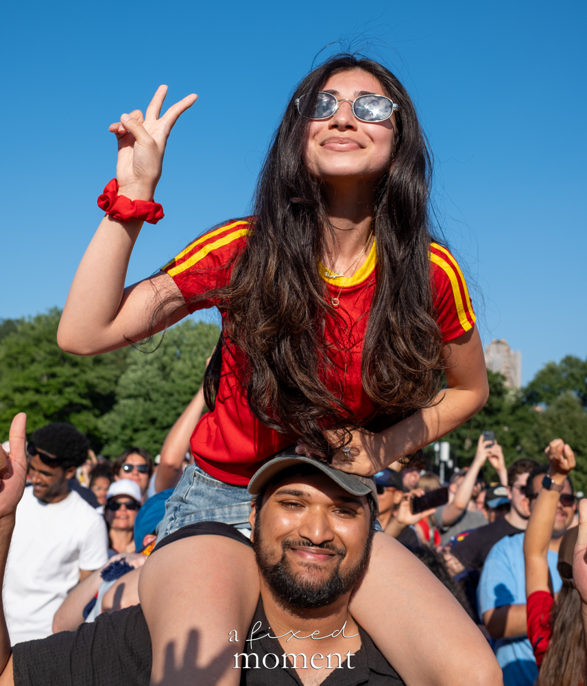 Spain supporter celebrating on a friend's shoulders in Central Park