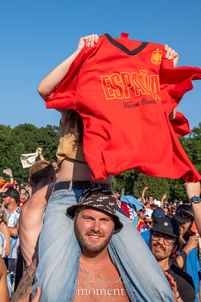 España victory shirt held above the crowd at the Central Park World Cup watch party