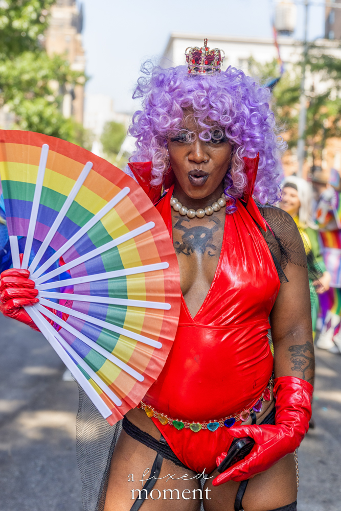 Bodymeccanix red vinyl rainbow fan portrait at NYC Pride March 2026