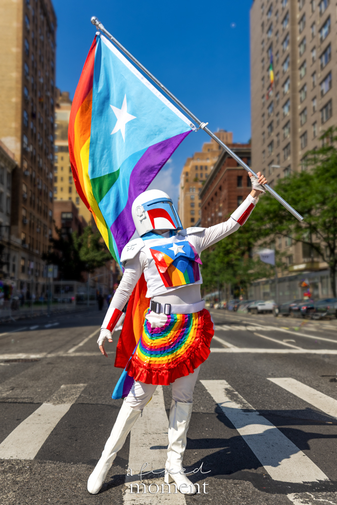 Floris Lilium armored Pride cosplay with large flag at NYC Pride March 2026