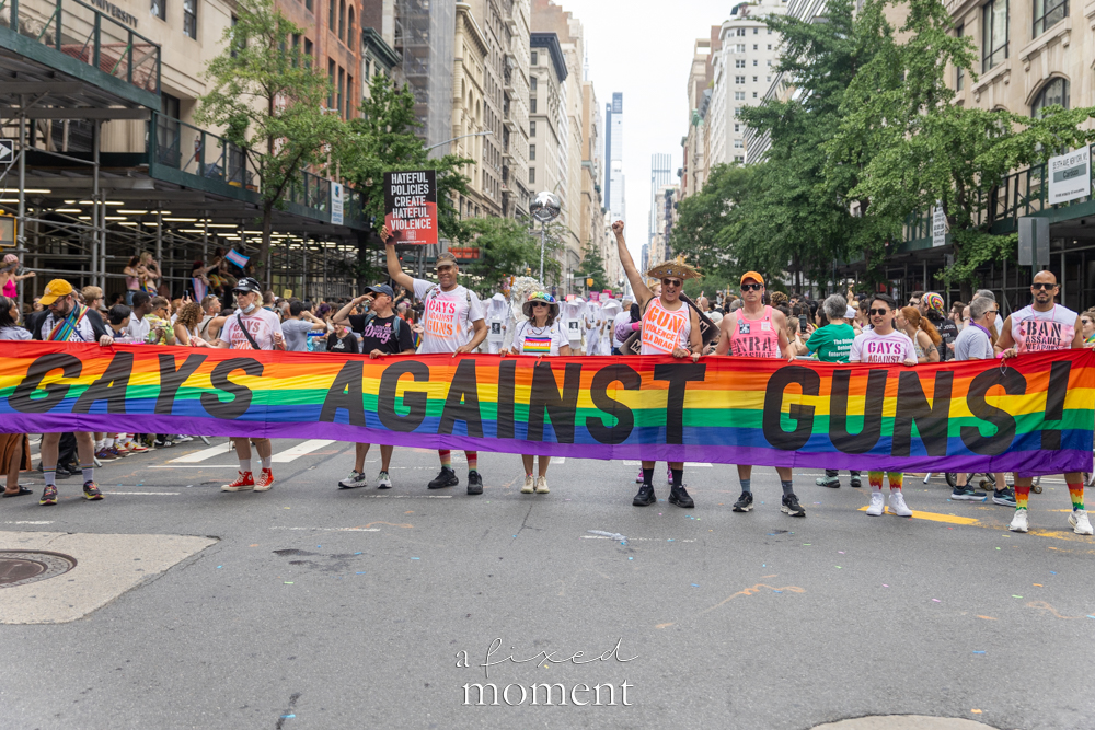 Gays Against Guns rainbow banner during NYC Pride March 2026