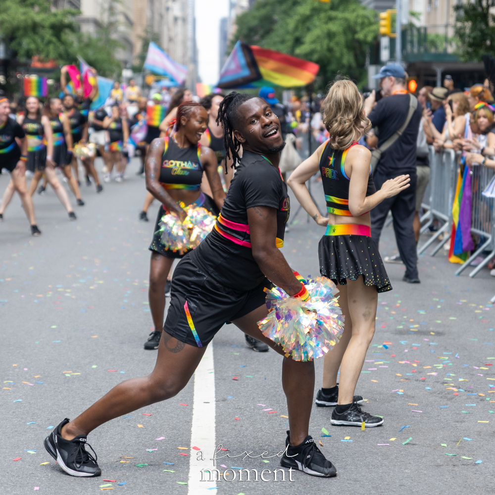 Gotham Cheer dancers with Pride flags during NYC Pride March 2026