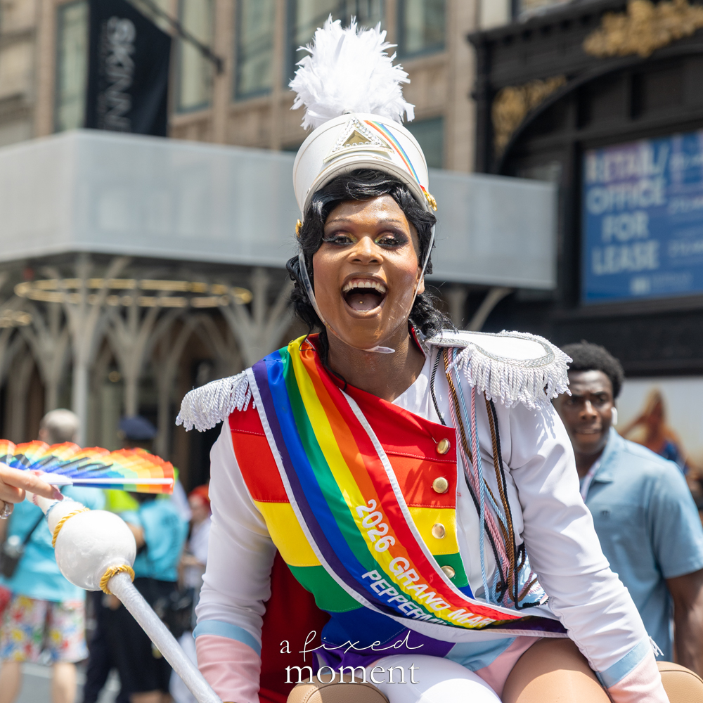 Peppermint Grand Marshal in white marching band costume at NYC Pride March 2026
