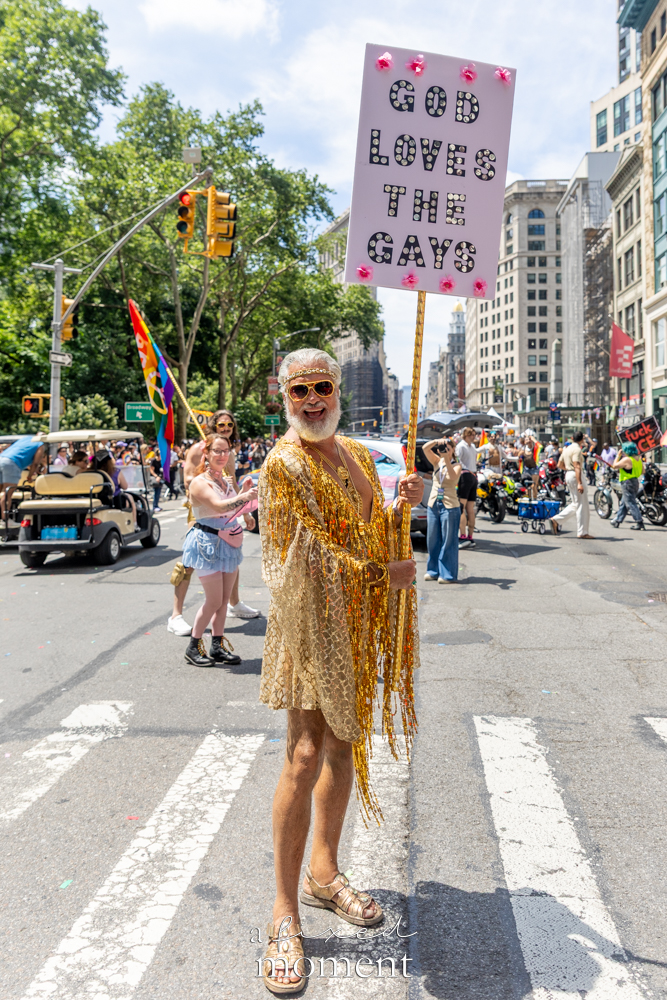 Steven Menendez holding God Loves the Gays sign at NYC Pride March 2026