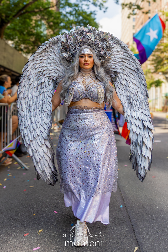 Vitani Beauty silver wings full body portrait at NYC Pride March 2026