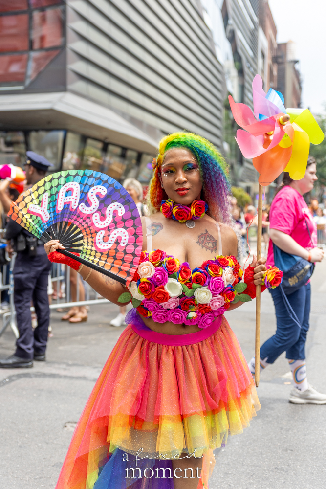 YASSS fan and rainbow floral costume at NYC Pride March 2026