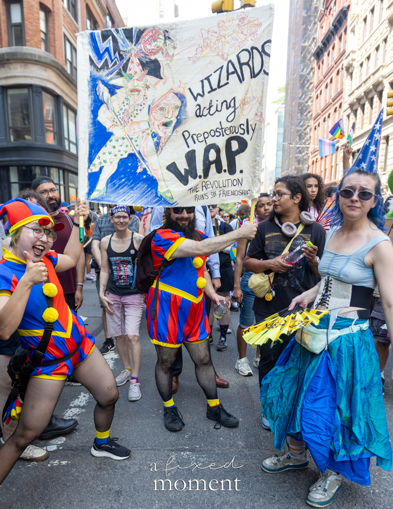 Wizards Acting Preposterously banner with costumed marchers at the 2026 Queer Liberation March in Manhattan