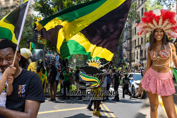 Jamaican flags, dancing paradegoers and a feathered carnival participant at the Jamaica Rising Day Parade in Brooklyn.