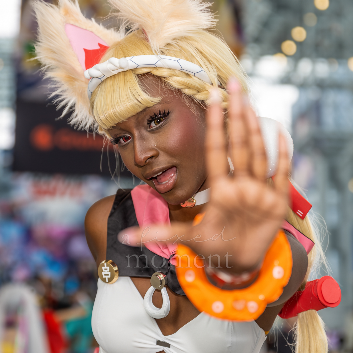 @kriscosp poses in cat-ear cosplay during Anime NYC 2026