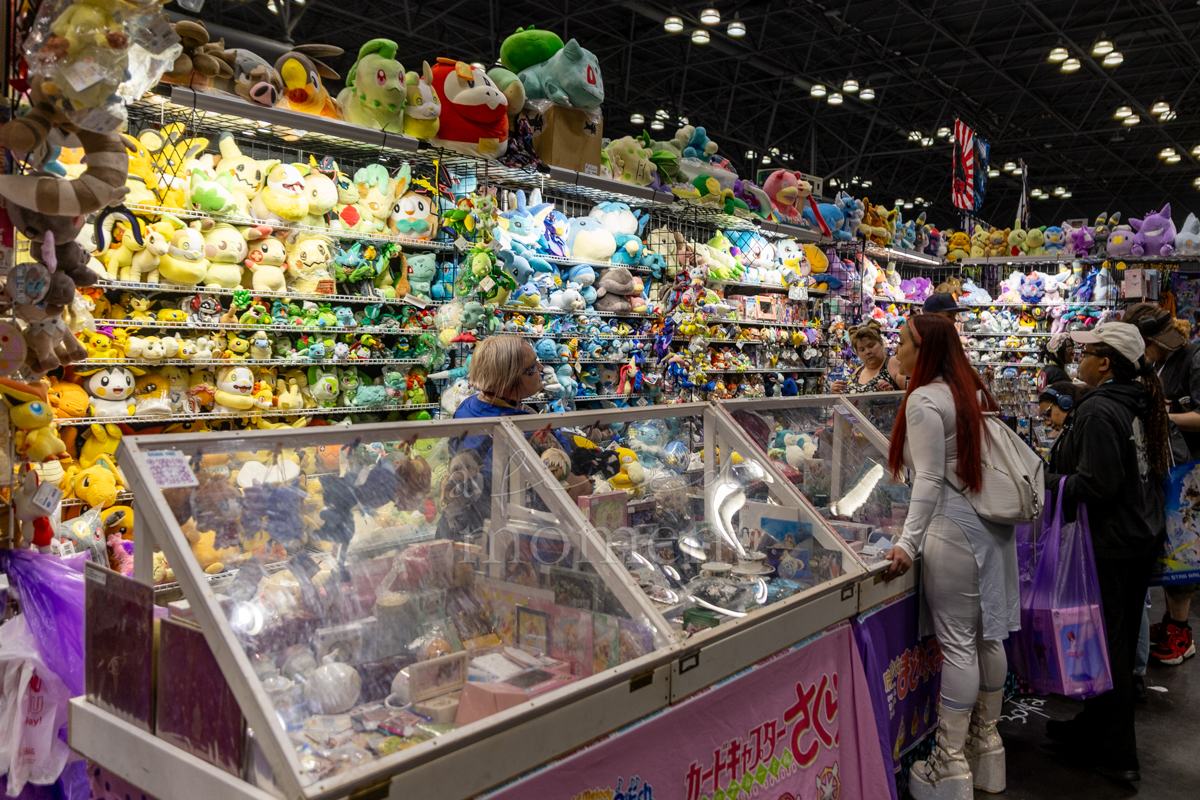 Crowd browses plush toys and anime merchandise during Anime NYC 2026