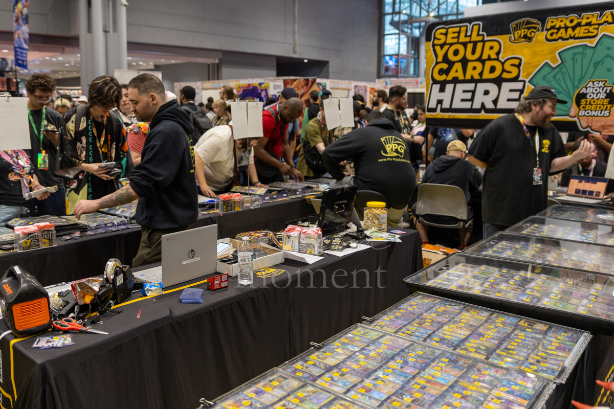Trading card vendors and attendees at Pro-Play Games during Anime NYC 2026