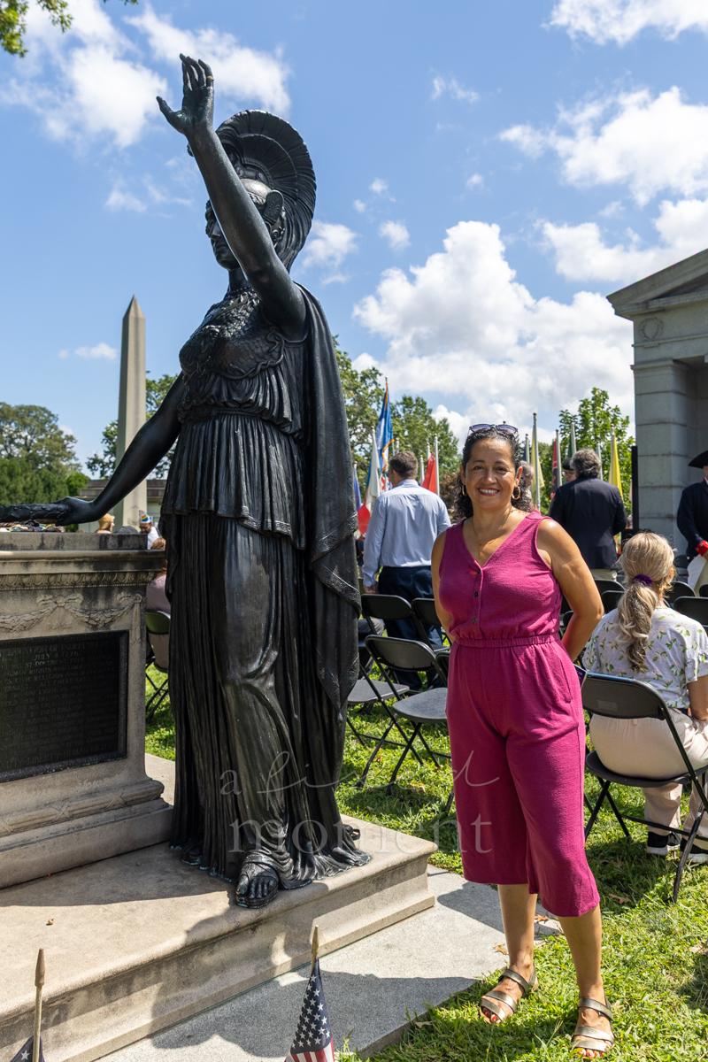New York City Councilmember Alexa Avilés beside the Minerva statue at Battle Hill