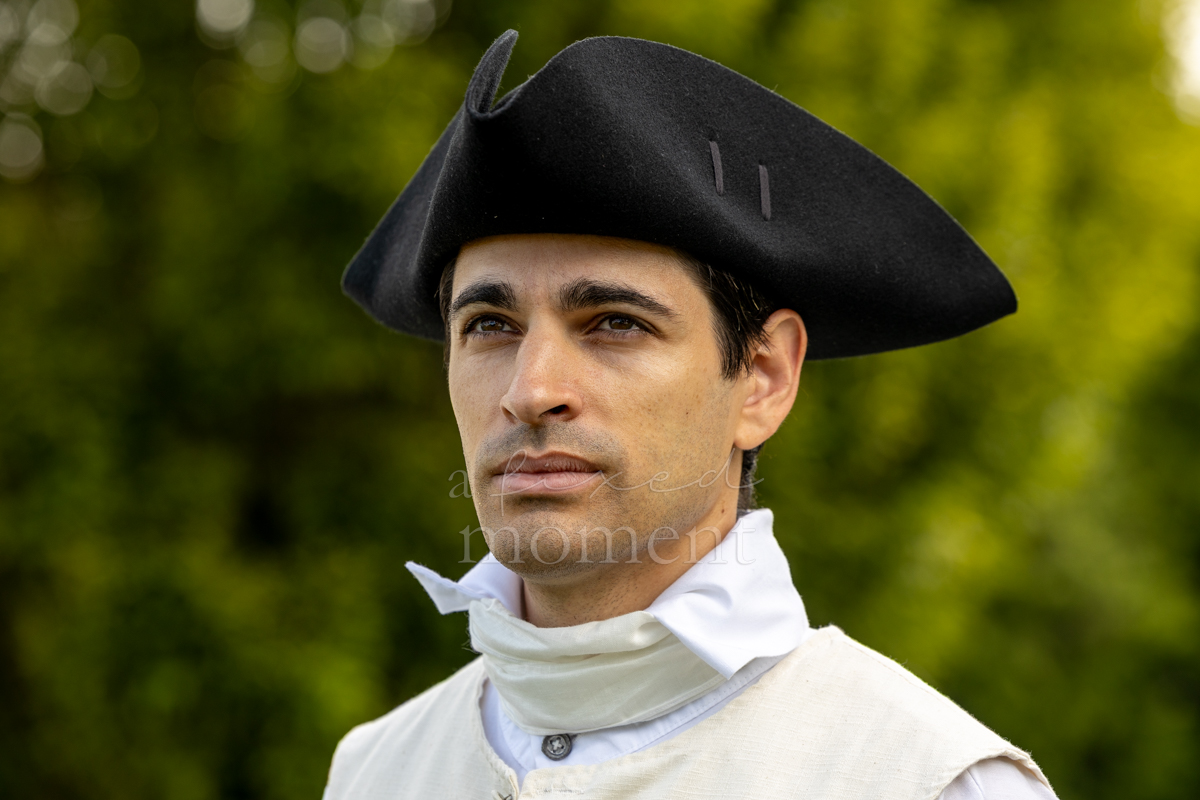 Historical interpreter wearing a cocked hat during the Battle of Brooklyn 250 program