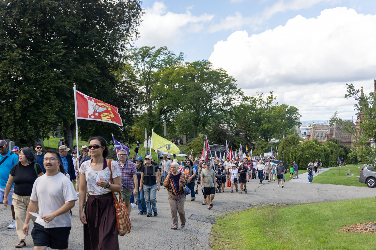 Visitors climb toward Battle Hill during the Battle of Brooklyn 250 commemoration at Green-Wood Cemetery