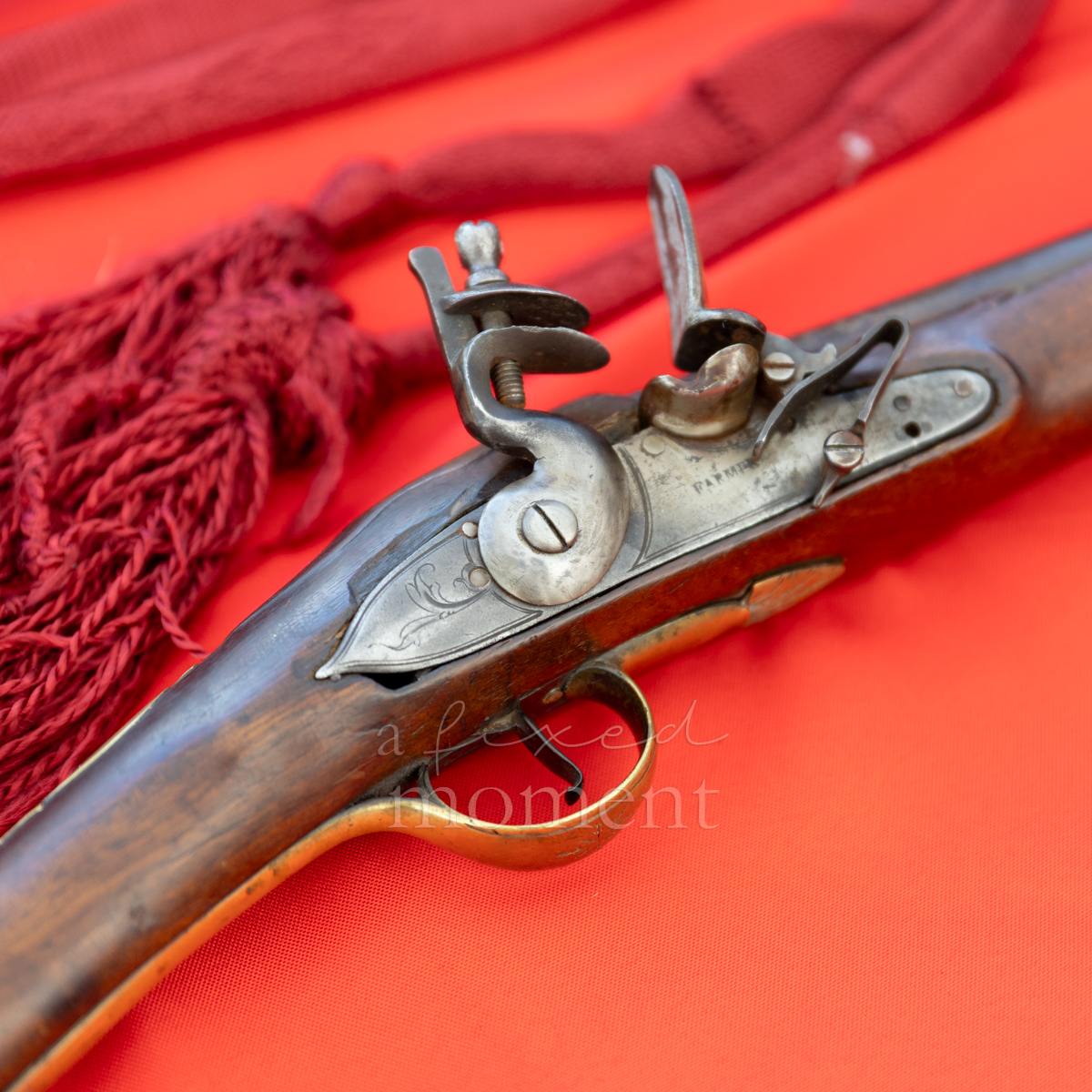 Detail of a flintlock firearm displayed during the Battle of Brooklyn 250 living-history program