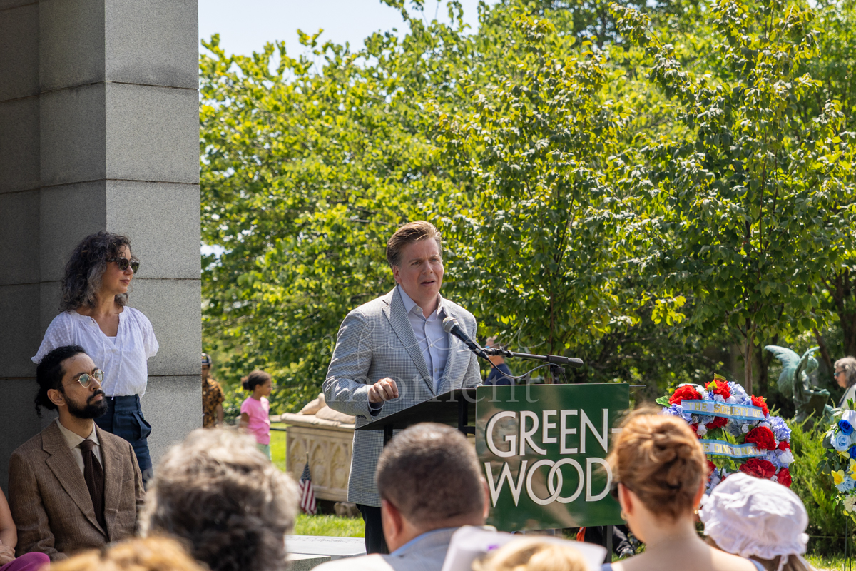 New York State Assemblymember Robert C. Carroll delivers remarks during the Battle of Brooklyn 250 ceremony