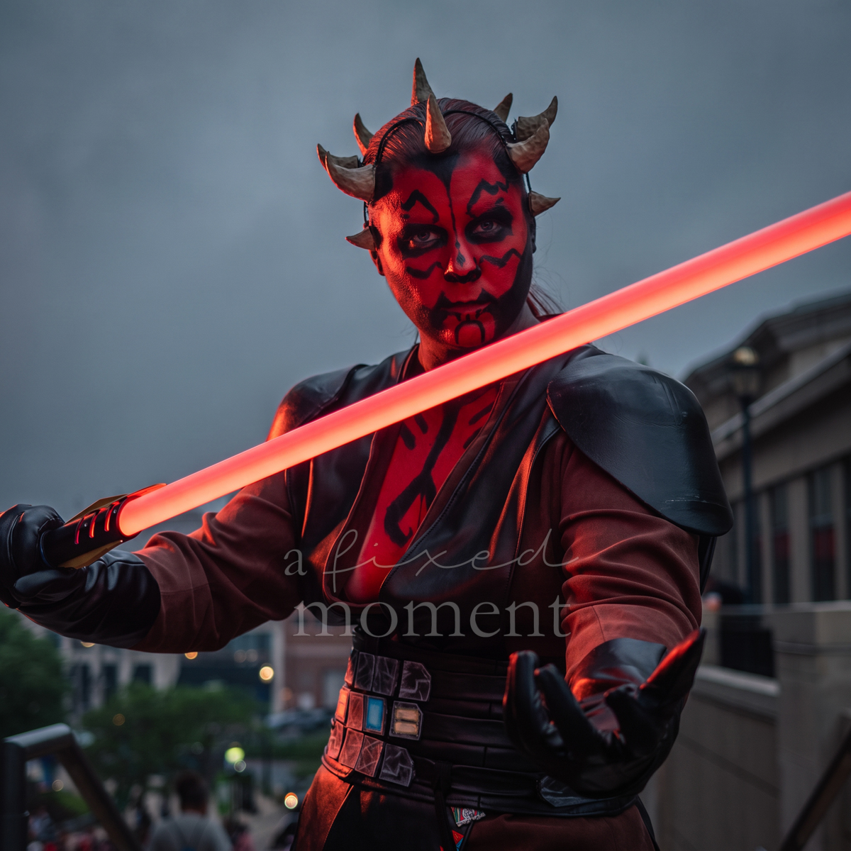 Darth Maul Star Wars cosplay with red lightsaber outside ConnectiCon 2026