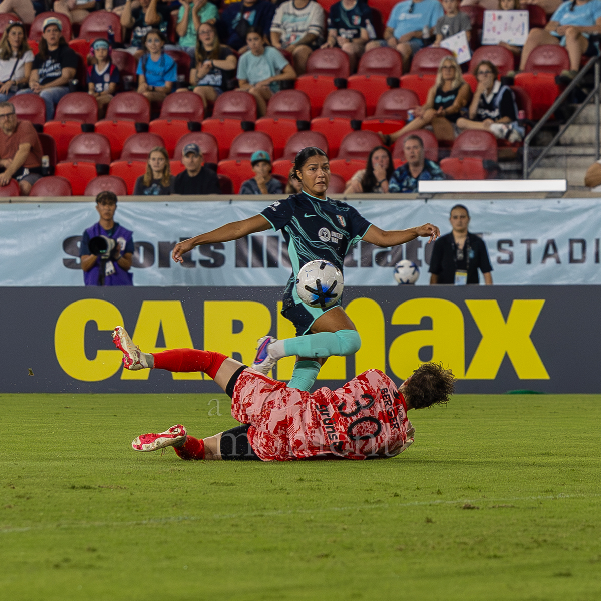 A Gotham FC attacker challenges Kansas City goalkeeper Marisa Jordan near goal