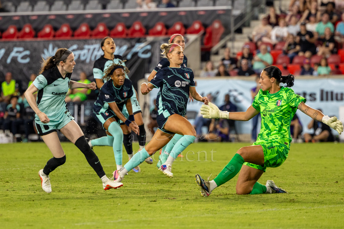 Kansas City Current goalkeeper Marisa Jordan slides toward the ball against Gotham FC