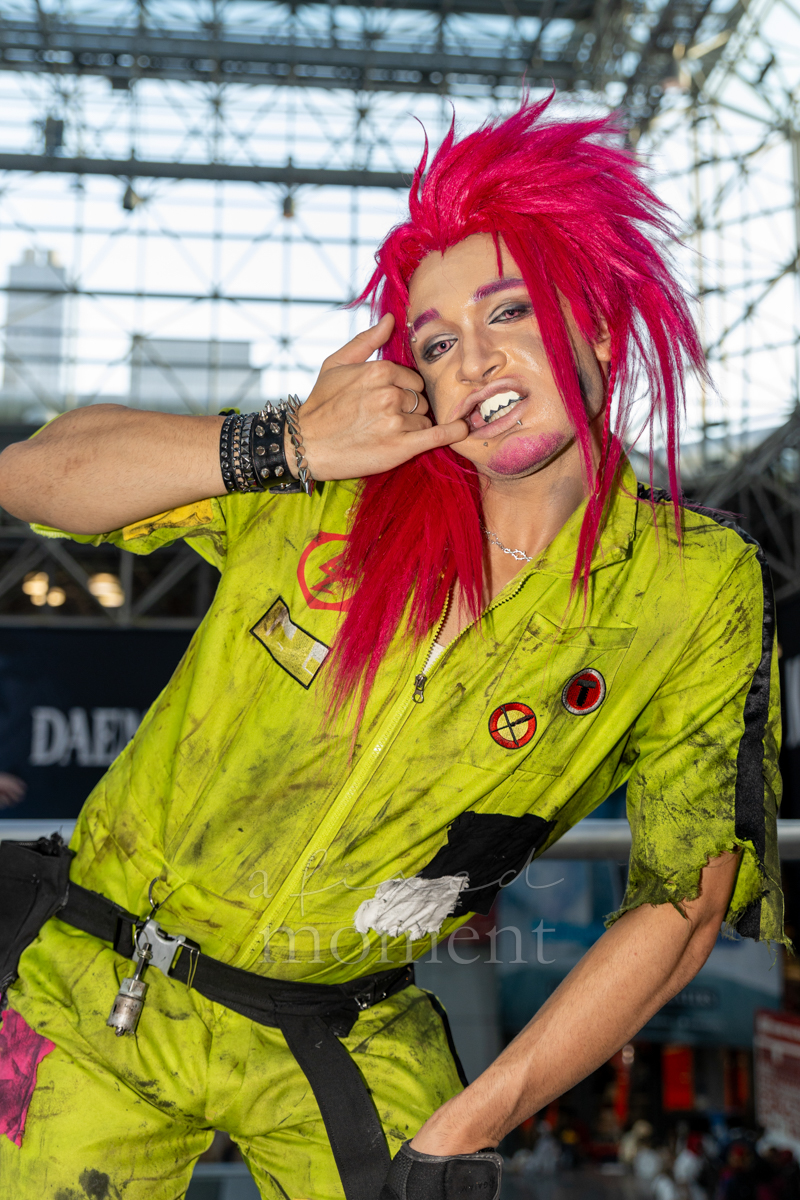 @_h3rmez_ in a distressed neon jumpsuit at Anime NYC 2026 Day Two