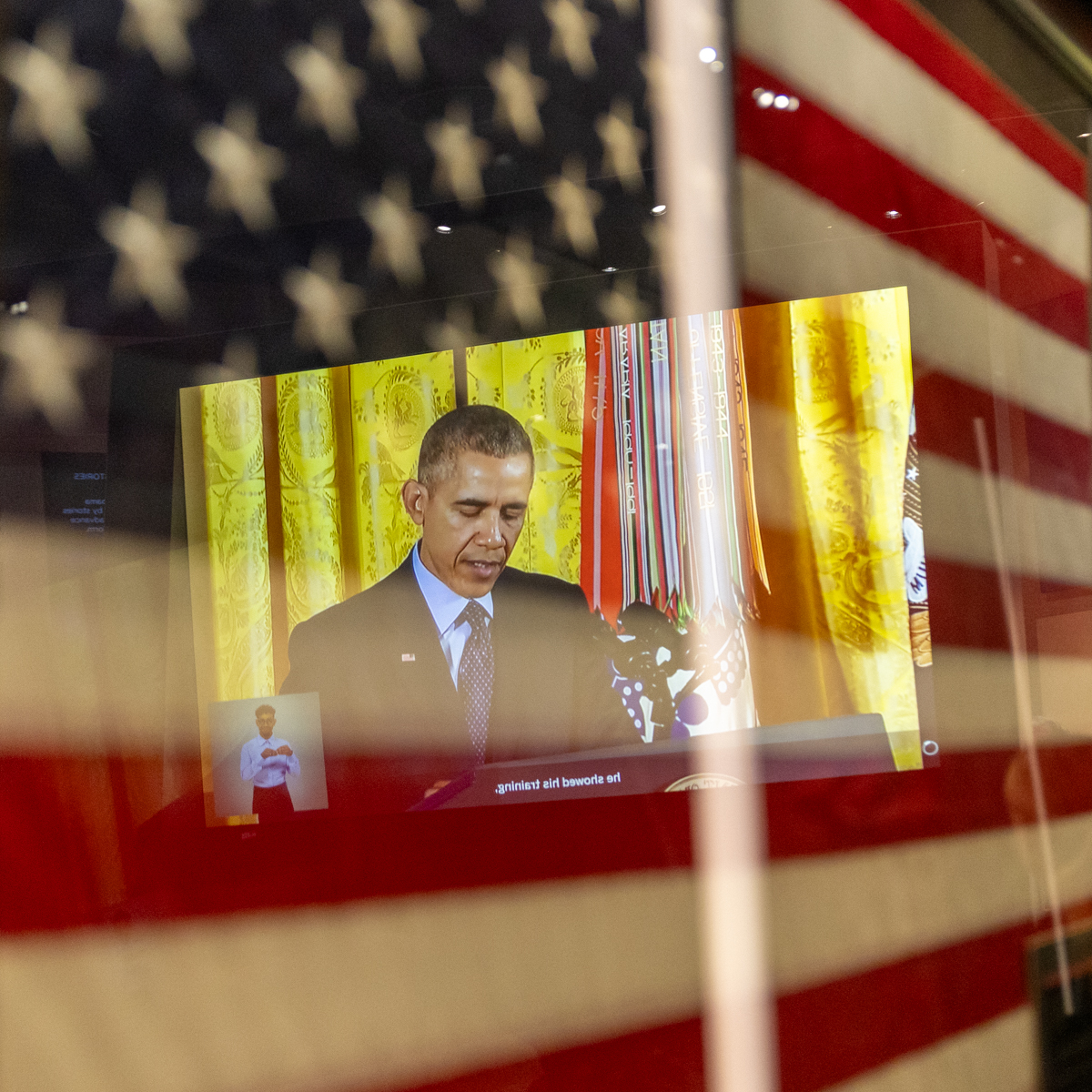 American flag and video display inside the Obama Presidential Center Museum