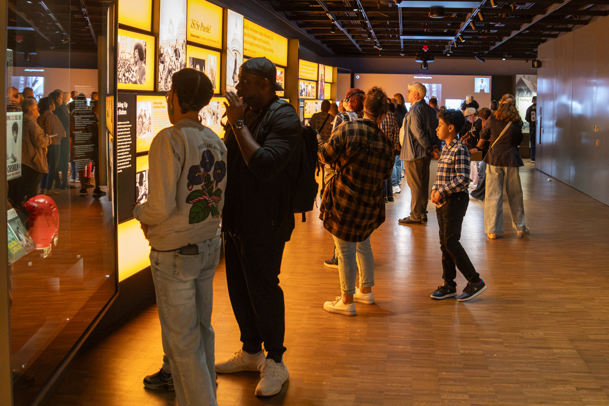 Visitors explore a history gallery inside the Obama Presidential Center Museum