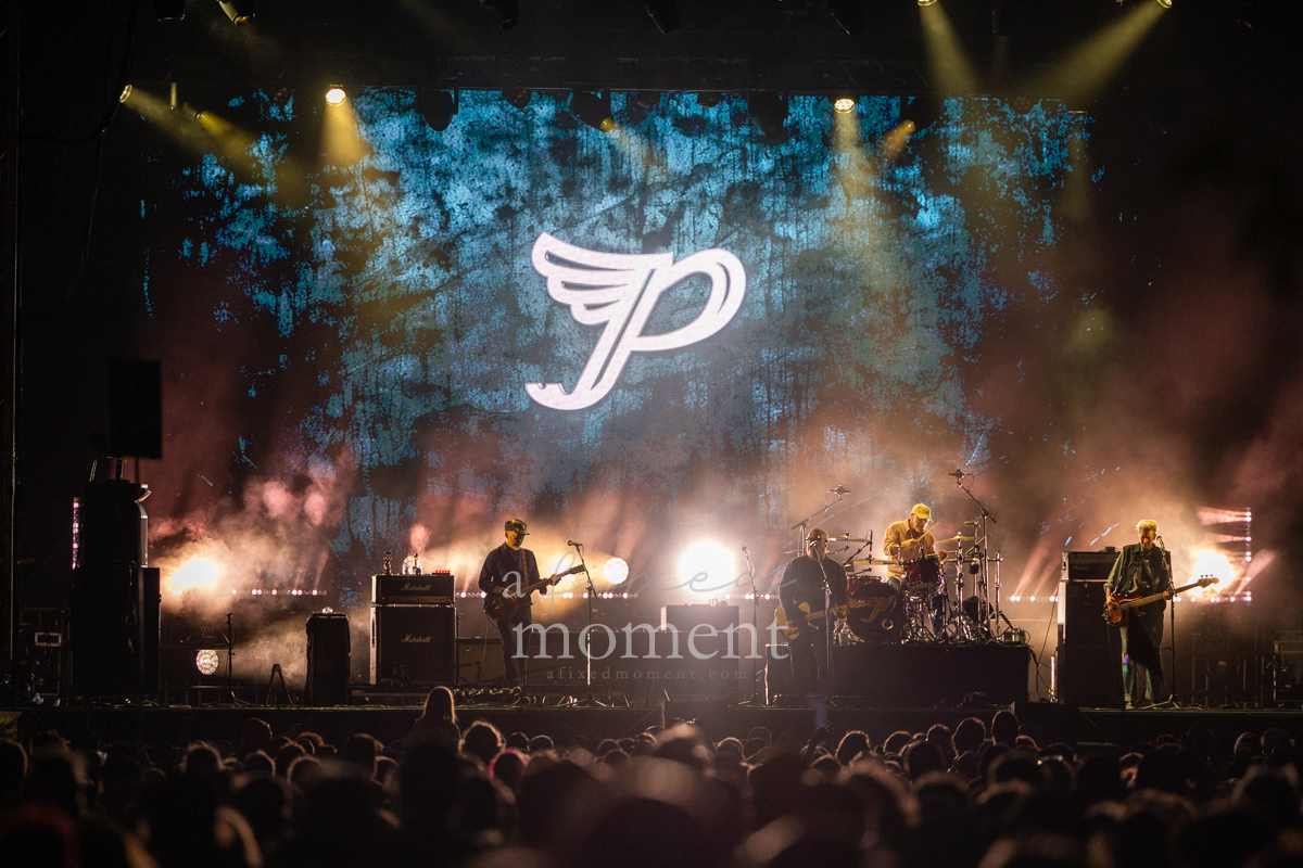 Pixies perform beneath their winged P logo at Riot Fest 2026 in Chicago