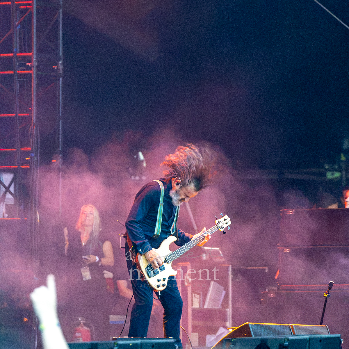Tool bassist headbangs while performing at Riot Fest 2026