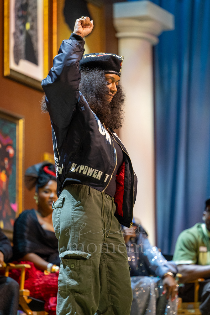 Raised-fist runway pose