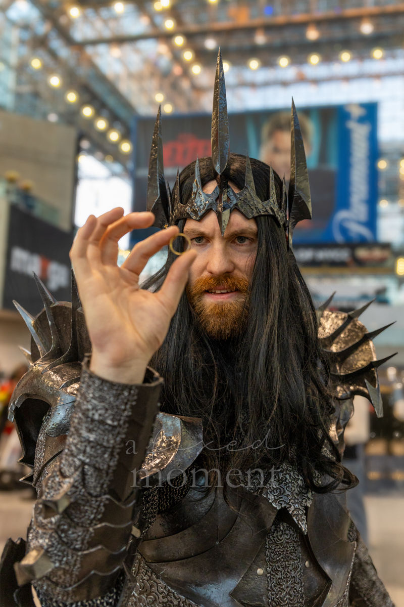Cosplayer wearing black armor and a spiked crown at New York Comic Con 2026