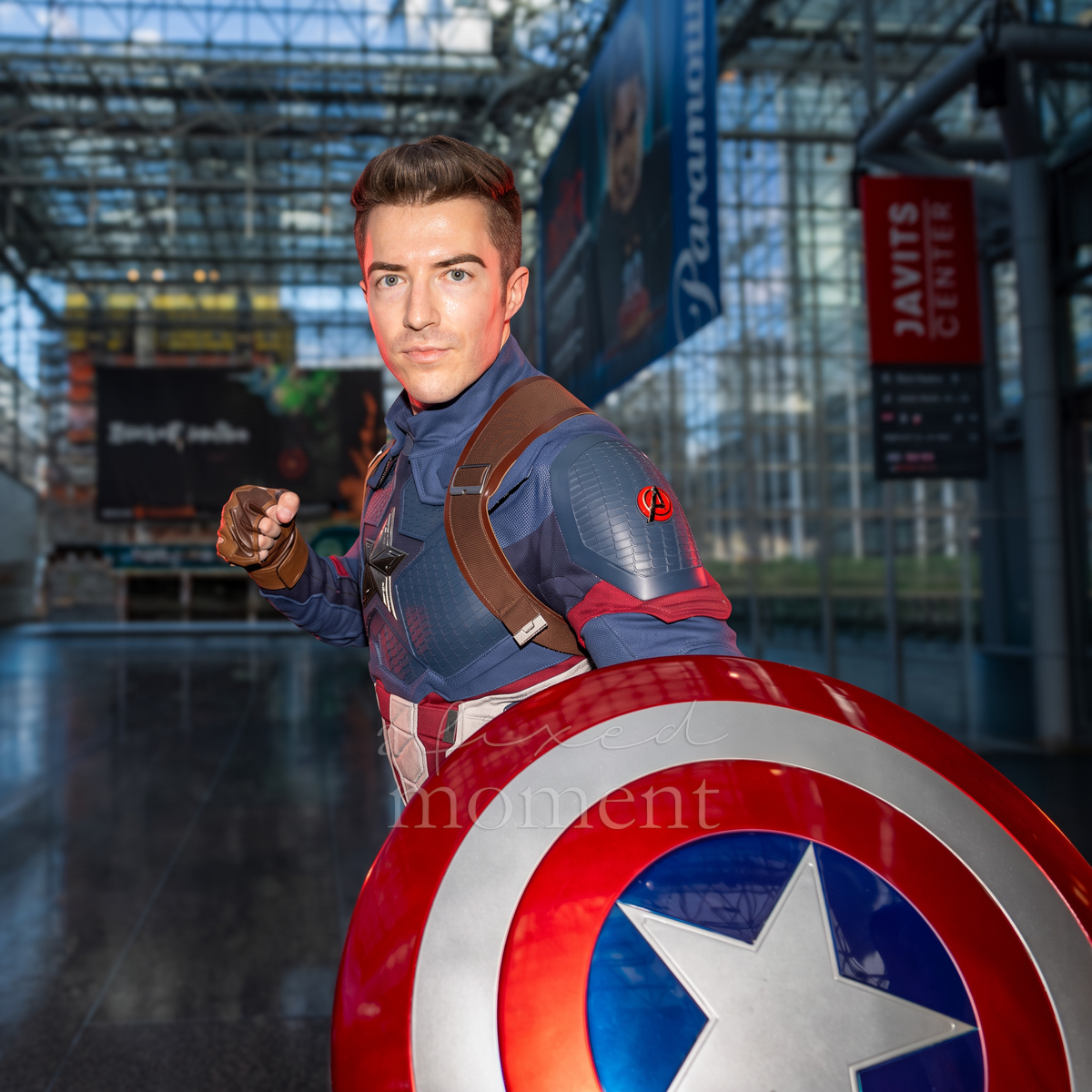 Captain America cosplayer holding a red, white and blue shield at New York Comic Con 2026