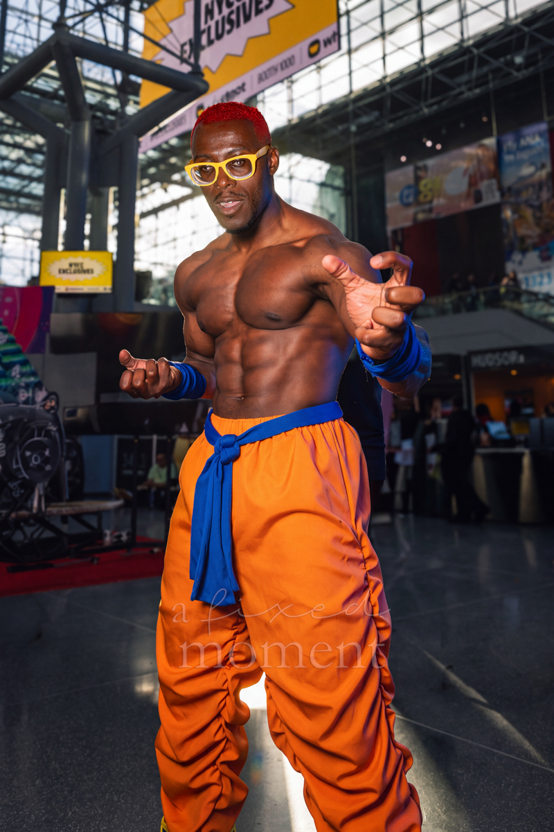 Master Roshi cosplayer posing in orange trousers at New York Comic Con 2026