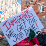 A demonstrator at the 50 50 1 march on February 17, 2025, in New York City proudly holds up a large sign reading "IMMIGRANTS, WE GET THE JOB DONE!" in bold red, black, and blue letters. The phrase, popularized by the musical Hamilton, has become a rallying cry for immigrant rights and contributions to society. The protester, wearing green gloves and a red coat, grips the sign firmly amidst a crowd of demonstrators.
In the background, another protester holds a sign stating "TRANS RIGHTS ARE HUMAN RIGHTS" in blue, red, and green letters, reinforcing the march’s focus on intersectional justice and equality. A third sign in the crowd reads "THE THREAT IS COMING FROM INSIDE THE HOUSE," a phrase often used in political discourse to highlight internal dangers to democracy.
The 50 50 1 march gathered activists, immigrants, and allies advocating for immigrant rights, LGBTQ+ protections, and democratic values. The scene, set against the backdrop of Washington Square Park, captures the energy and unity of the demonstration.