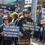 At the Picket Tesla protest organized by Rise and Resist (@risenresistnyc) on March 1, 2025, outside the Tesla Showroom at 860 Washington Street, NYC, demonstrators hold bold, satirical signs criticizing wealth inequality, corporate greed, and the influence of billionaires like Elon Musk.
In the foreground, two women stand prominently holding protest signs. The woman on the left, wearing a dark blue puffer jacket and purple sunglasses, holds a large blue sign that reads:
"TAX CUTS for BILLIONAIRES. No school lunch for your kids."
Beside her, another protester in a black jacket, sunglasses, and a scarf holds a black sign featuring an edited image of Elon Musk, reading:
"THIS IS THE IMMIGRANT WHO TOOK YOUR JOB."
This sign sarcastically flips anti-immigration rhetoric on its head, criticizing the narrative that working-class struggles are due to immigrants rather than billionaire corporate policies.
Behind them, more protesters hold signs, including one that says "THIS MUSK BE STOPPED" and another that reads "MUSK IS A KETAMINE ADDLED KLEPTOCRAT." Protesters wear warm clothing, suggesting cool weather, and actively engage in the demonstration, holding up signs and conversing. The urban setting is bustling, with more demonstrators visible in the background carrying additional signs targeting economic and corporate policies.
This protest by Rise and Resist (@risenresistnyc) aligns with the group's activism against corporate corruption, advocating for economic justice and accountability.