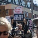 At the Picket Tesla protest organized by Rise and Resist (@risenresistnyc) on March 1, 2025, outside the Tesla Showroom at 860 Washington Street, NYC, a demonstrator energetically holds up a black-and-white sign reading: "RISE AND RESIST." Behind him, another protester holds a red and white sign that states: "HEY ELON, QUIT USING OUR COUNTRY AS YOUR PLAYGROUND."
The crowd is filled with passionate demonstrators, many of whom are holding signs targeting Elon Musk, Tesla, and billionaire influence. To the left, a cardboard sign reads "FK MUSK!"** in bold black letters, reflecting the intensity of the protest. Another sign in the background warns about data privacy concerns and criticizes Musk's involvement in politics and government policies.
The demonstrators wear a mix of sunglasses, hats, and jackets, suggesting cool weather. A man at the center of the image, raising the "RISE AND RESIST" sign, wears a colorful knit cap and a dark sweater, his mouth open as if shouting or chanting. Others in the crowd are engaged in conversations, holding up their signs, or looking toward the protest's focal points.
This protest by Rise and Resist (@risenresistnyc) is part of a broader movement advocating against corporate overreach, billionaire control, and economic injustice. The protesters’ visual statements and collective energy demonstrate their opposition to Musk’s influence and Tesla’s policies.